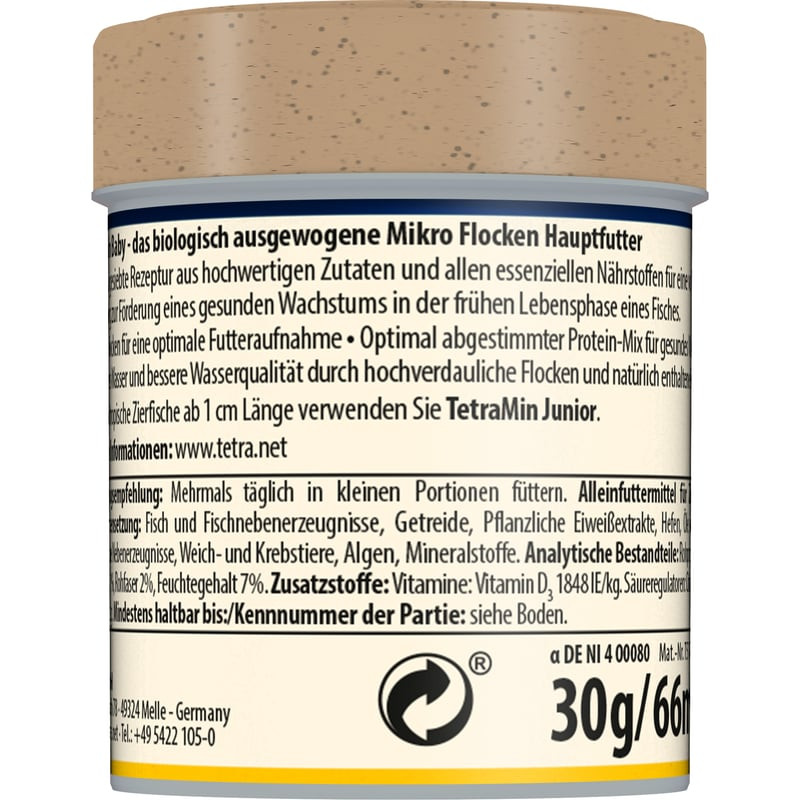 Gros plan sur les micro-flocons TetraMin Baby montrant leur texture fine et leur couleur