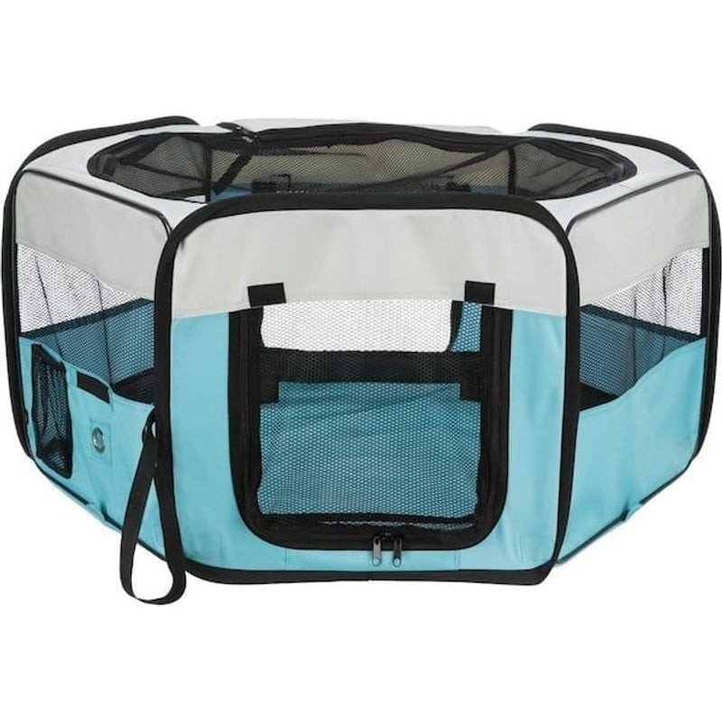 Enclos pliable TRIXIE bleu et gris installé à l'extérieur, avec filet supérieur et poches latérales 