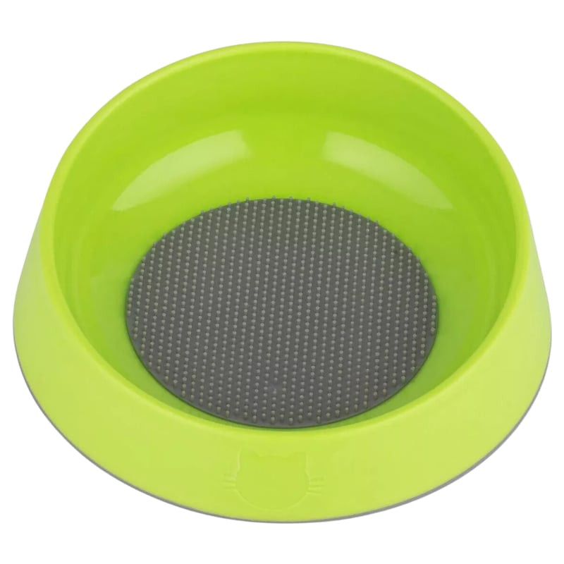 Bol LickiMat OH pour chat vert avec pointes en caoutchouc doux sur une surface texturée.