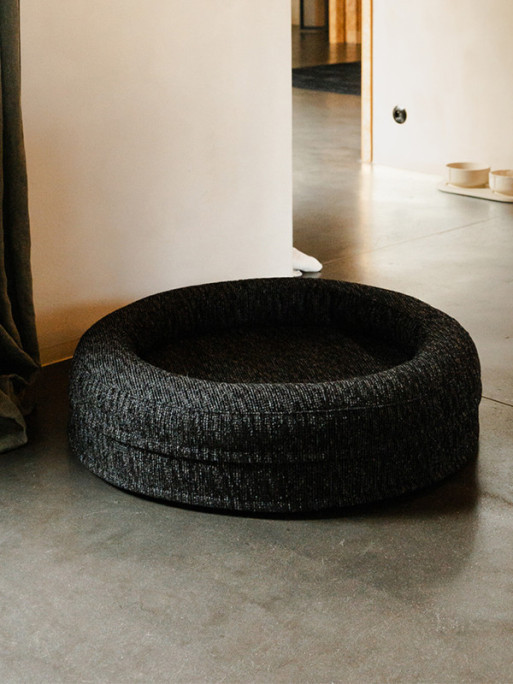 VADIGRAN Fantail Elite cushion on a patio, dog enjoying outdoor comfort on the orthopedic bolster.