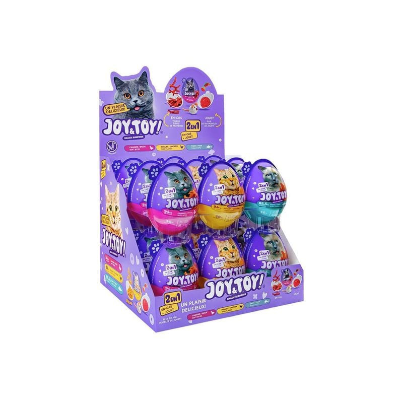 Joy & Toy Tuna Surprise Egg placed on a surface with cat toys nearby, showcasing the product as a re
