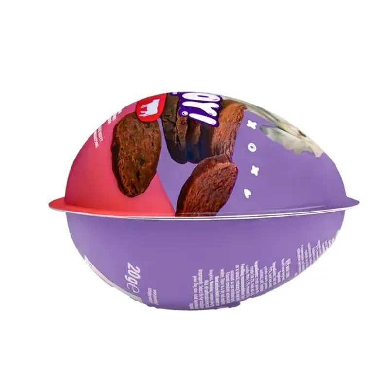 Detail of VADIGRAN Joy & Toy egg opened to reveal hidden surprise toy inside. Toy visible next to tr