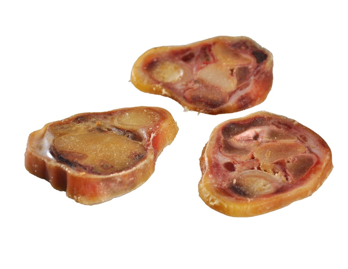 Packshot of Vadigran 100% natural pork leg bone slices dog treats, showing the vacuum-sealed package