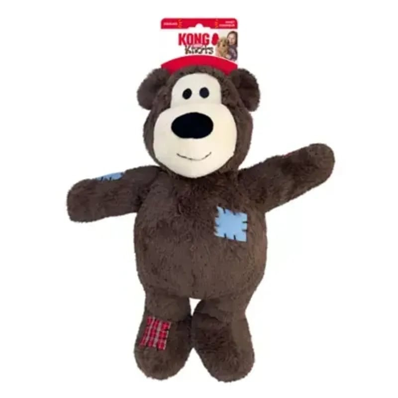 KONG Wild Knots Bear XL debout en pied sur fond blanc, peluche marron aux bras étendus, patches bleu