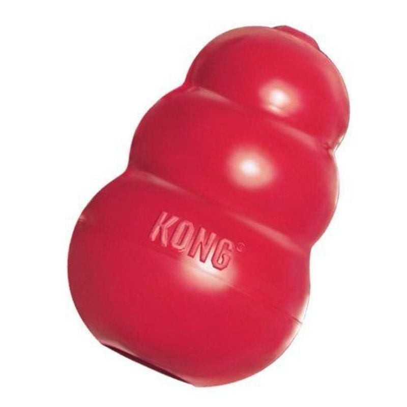 Jouet KONG Classic Medium caoutchouc rouge fond blanc, forme iconique extrémités arrondies centre cr