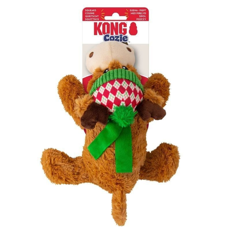 Jouet pour chien KONG Holiday Cozie Renne exposé sur une table, mettant en valeur sa texture douce e