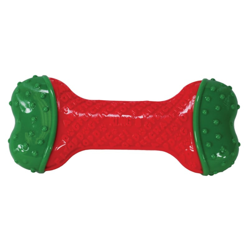 Jouet pour chien KONG Holiday CoreStrength Bone S/M aux couleurs festives rouge et vert sur fond bla